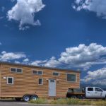gooseneck tiny house on road side view