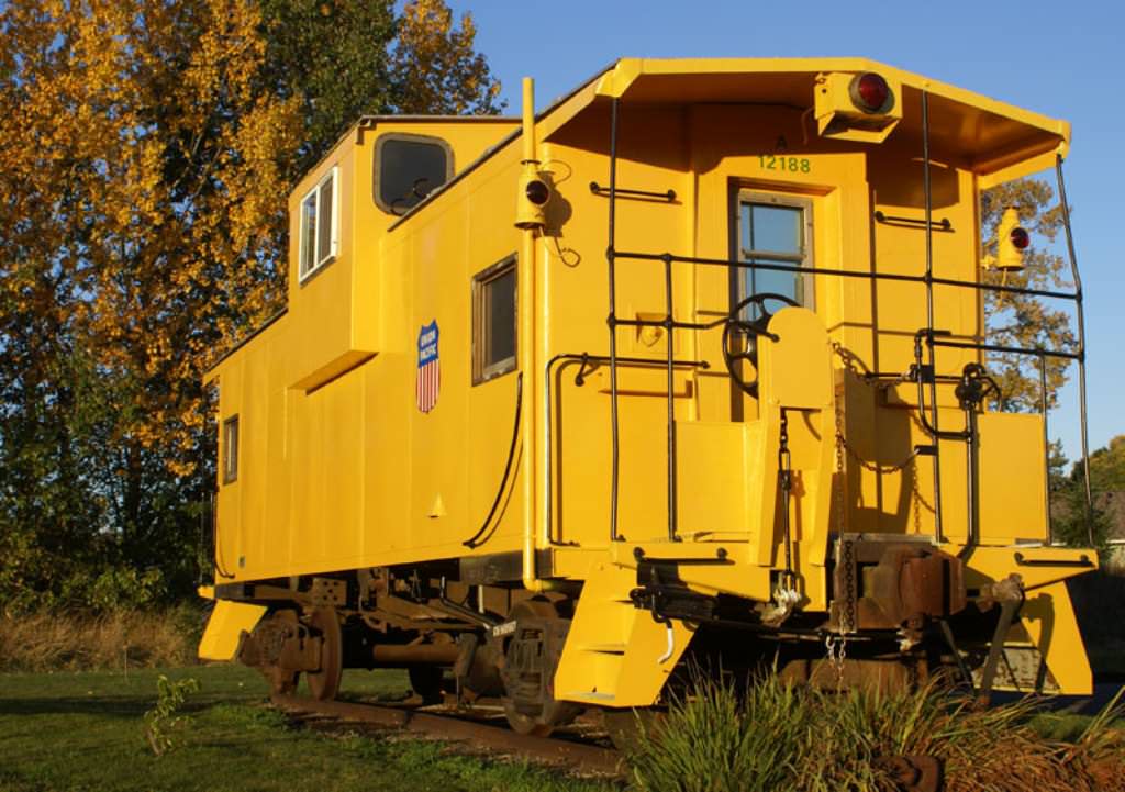 Image of: yellow caboose tiny house