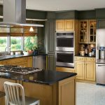 cream colored kitchen cabinets with stainless steel appliances